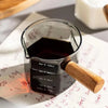Heat-Resistant Glass Measuring Cup with Wooden Handle for Easy Pouring - Clarify.pk