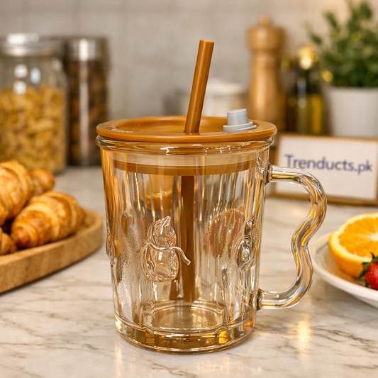 "Trenducts premium amber glass sipper cup with ergonomic handle and reusable straw."

"Transparent aesthetic glass tumbler with lid for iced coffee and juices in Pakistan."