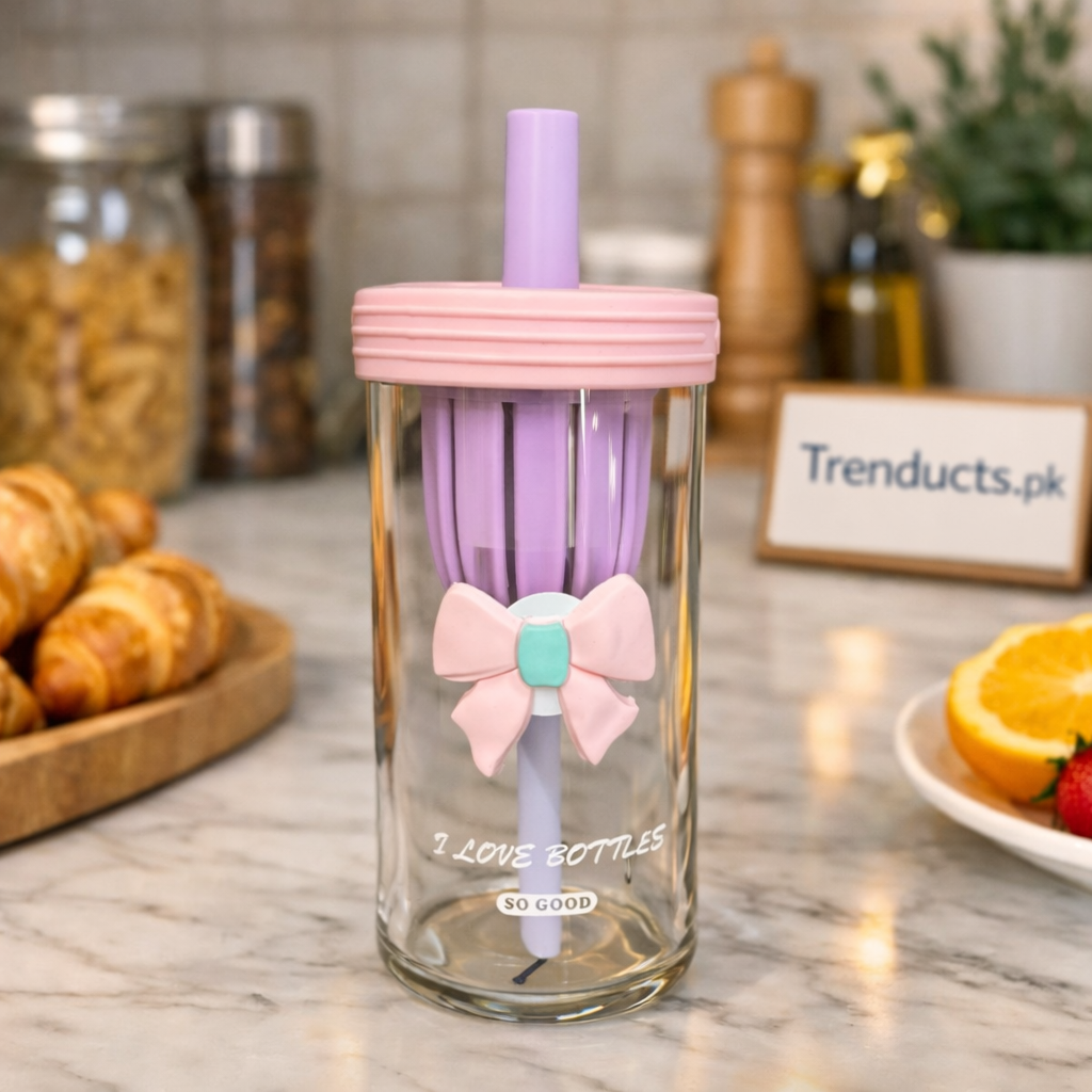 "Aesthetic glass sipper cup with handle and reusable straw on a minimalist office desk."

"Transparent 450ml glass tumbler for iced coffee and fruit juices in Pakistan."