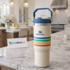 Stanley 30oz IceFlow Flip Straw Tumbler in Cream Stripe with retro multi-color stripes and blue carry handle - Trenducts Pakistan
