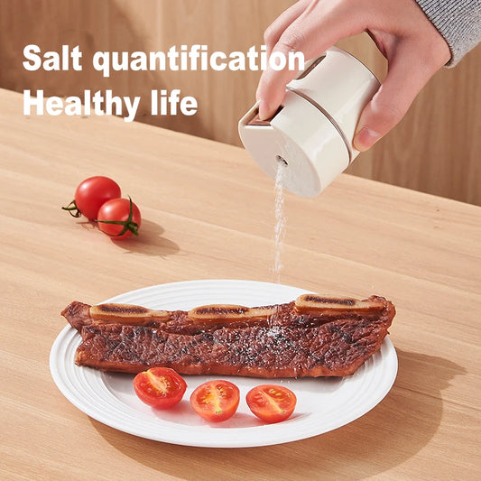 Precision Push-Button Spice Dispenser for measured salt and seasoning output, compact design for modern kitchens.