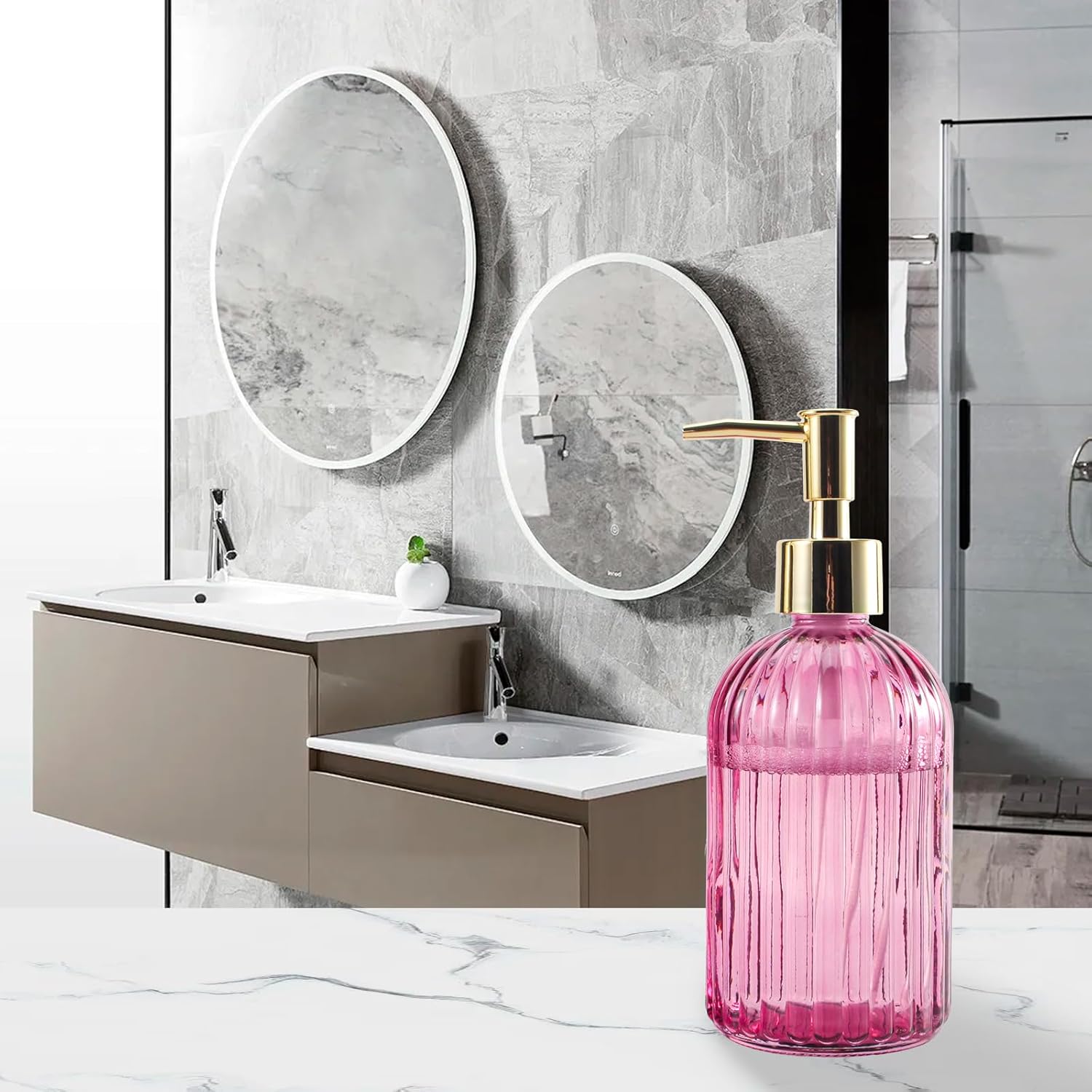 Tall emerald green and blue diamond-cut glass soap dispensers with gold pumps on a modern bathroom shelf - Trenducts Pakistan